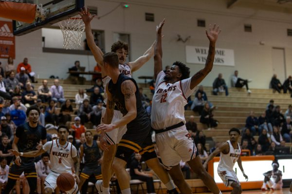 Rigatuso and Harvey block a layup attempt against Graceland keeping the score at 62-45.