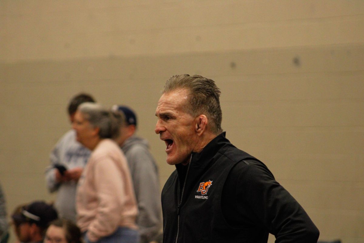 Coach Jimmy May coaches at the tournament named in his honor