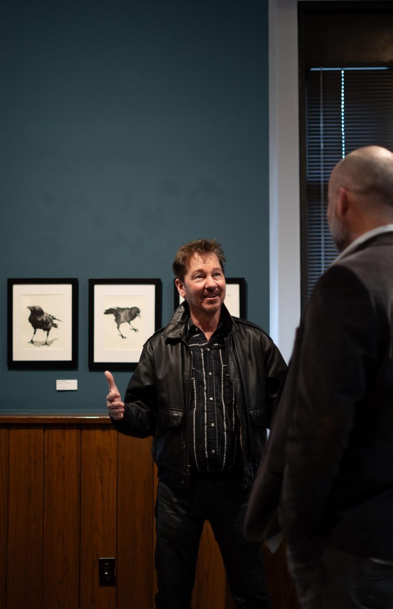 Artist Paul Lucas speaking with Juror Kent Michael-Smith