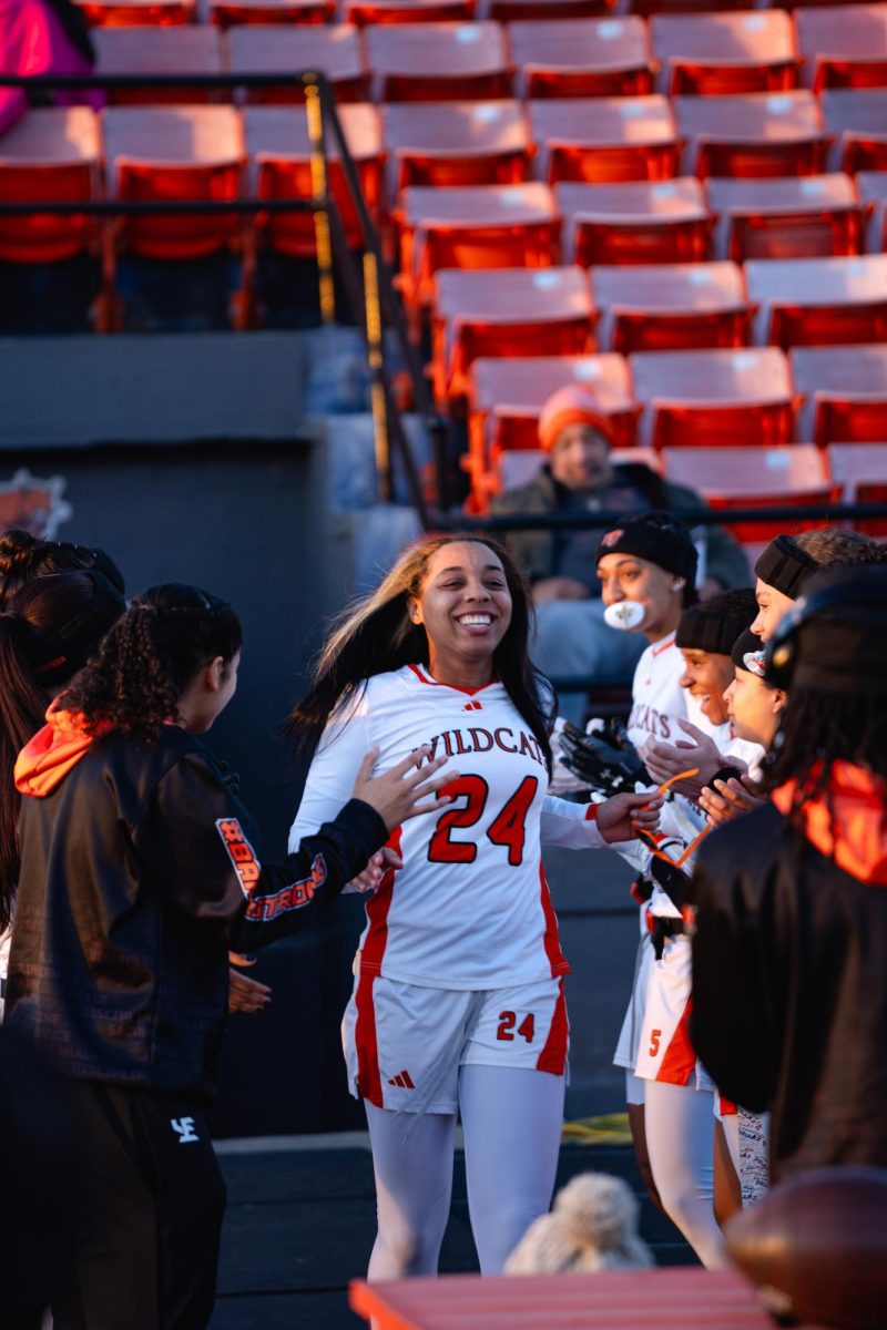 Sophomore Melanie Assmar runs out of the tunnel 