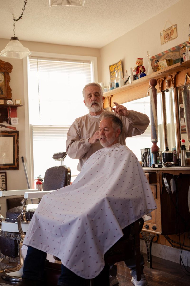 Ski giving a haircut to local customer