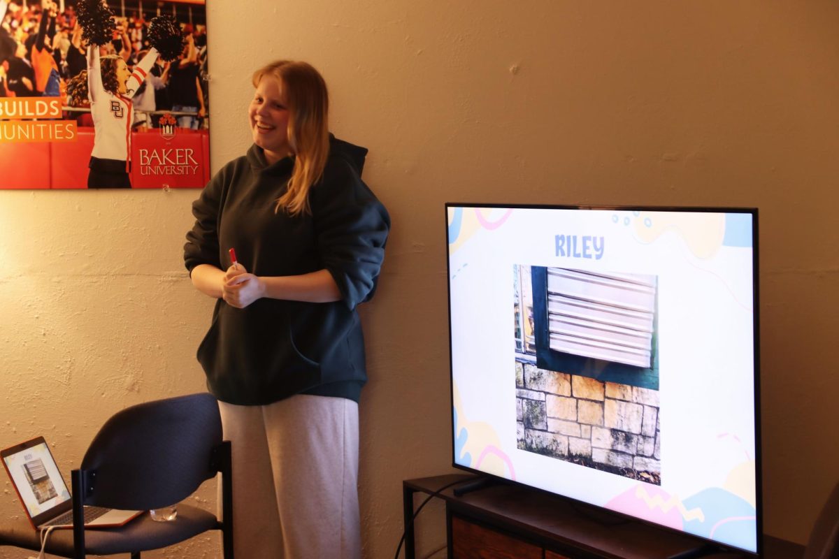 Senior B.U.G.S president Ella Hornberger gives clues to game show participants. 