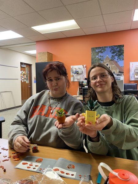 Two members of TEA showcase their crafts at Lego Night.
Madi Hargett (Left), Lee Smith (Right).
