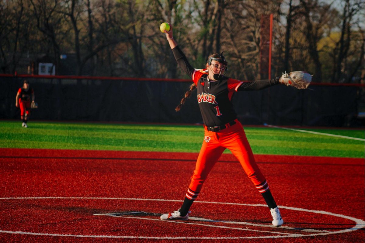 Camrynn Yardley in her windup, ready to deliver the pitch. 