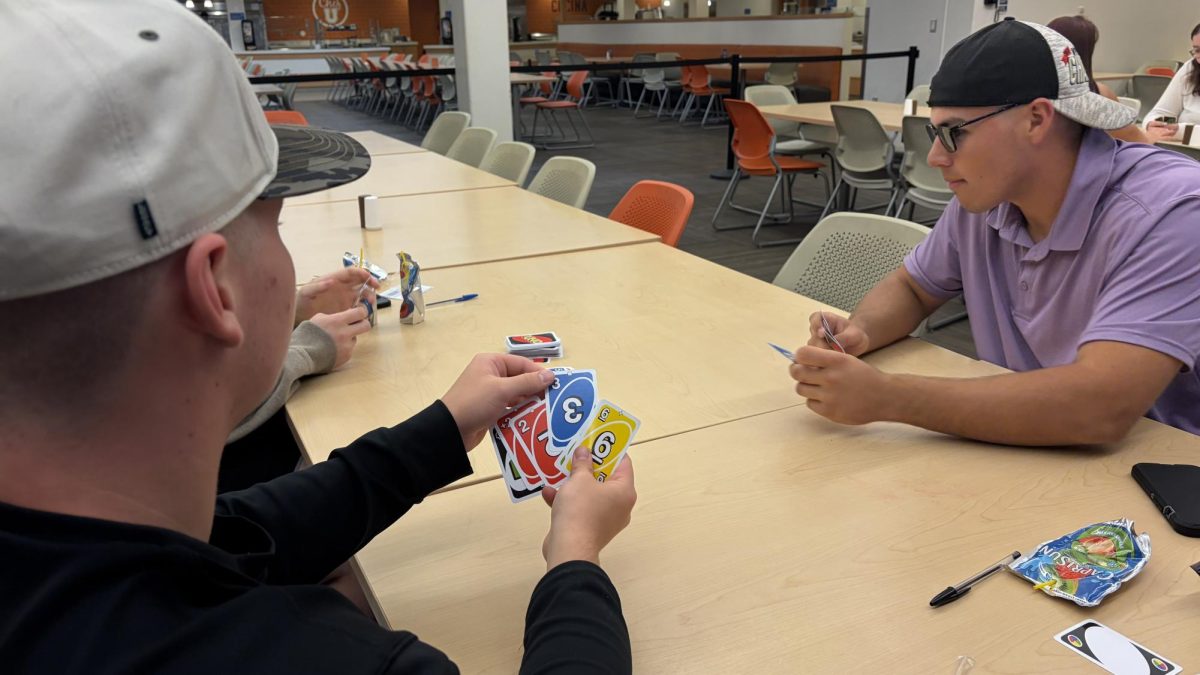 Brady Mack deciding on what card to play