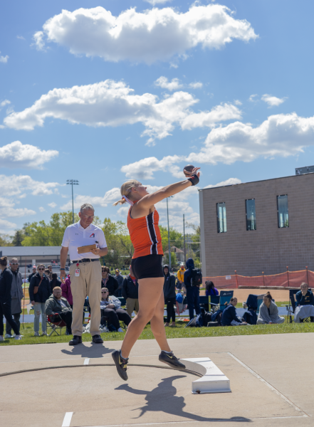 Senior Julie Coffey throws shot put at HOA conference.
